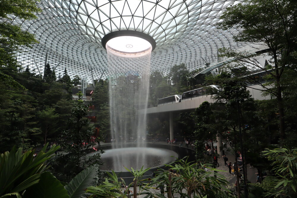 The Jewel – Rain Vortex with Skytrain passing by