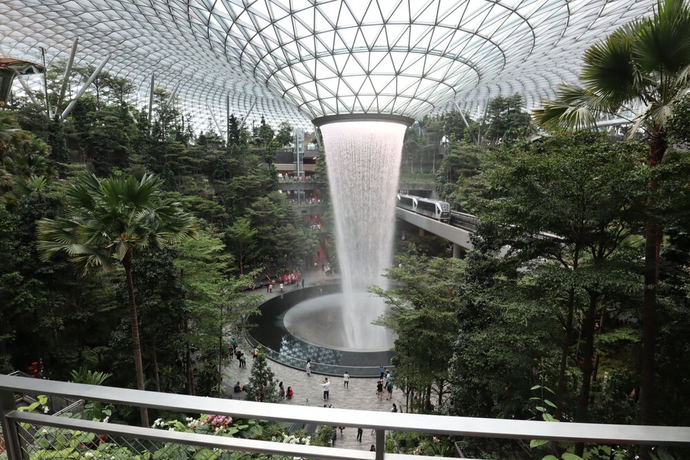 The Jewel – Rain Vortex with Skytrain passing by