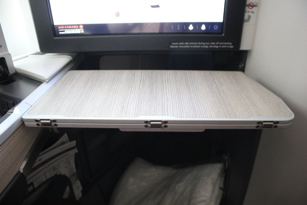 Air Canada business class – Tray table extended halfway