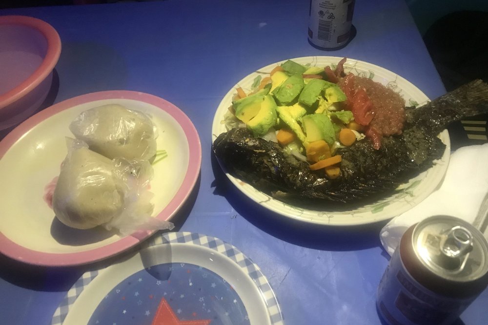 Grilled tilapia with chilli sauce and banku (corn and cassava dough)