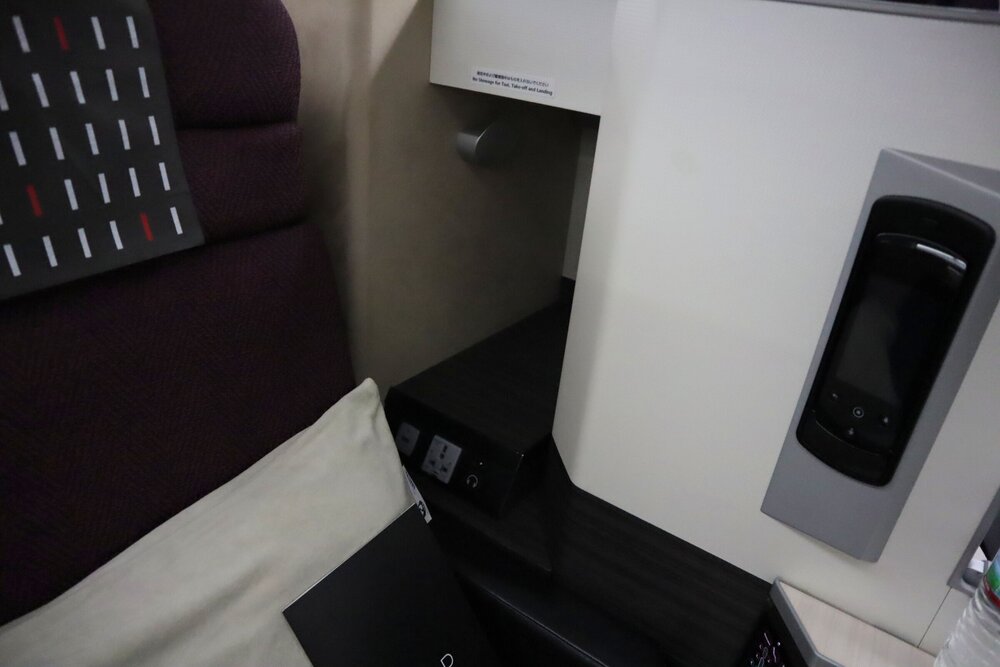 Japan Airlines business class – Seat 1C storage compartment