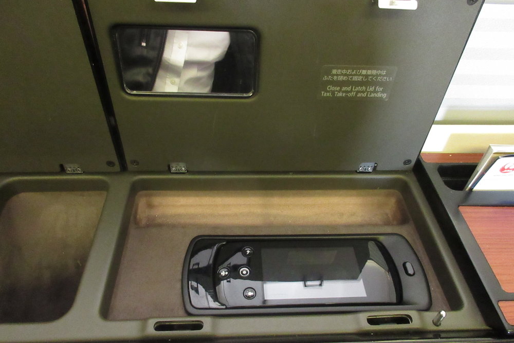 Japan Airlines First Class – LCD entertainment controls and mini mirror