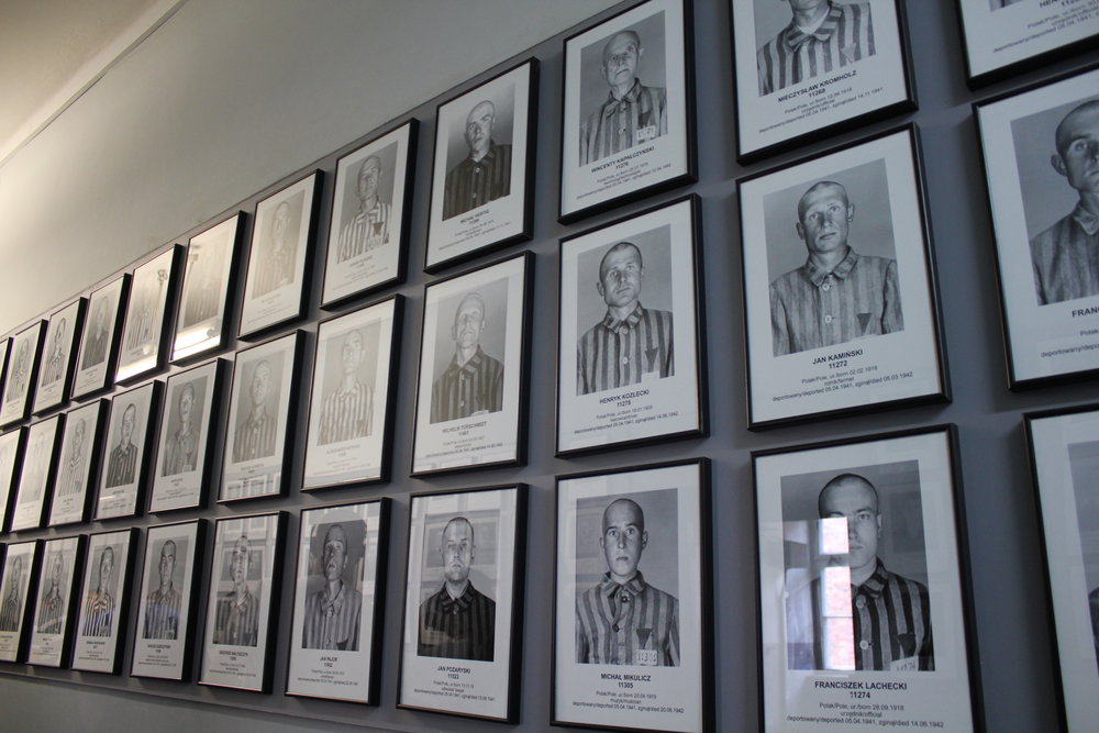 Photos of Holocaust victims, taken from the Nazi files, are hung up along this wall to honour their memory