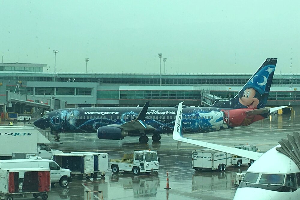 WestJet’s custom-painted Boeing Next Generation 737-800; although we didn’t get to fly on this one, seeing it at our departure gate was enough to get the kids excited for our flight.