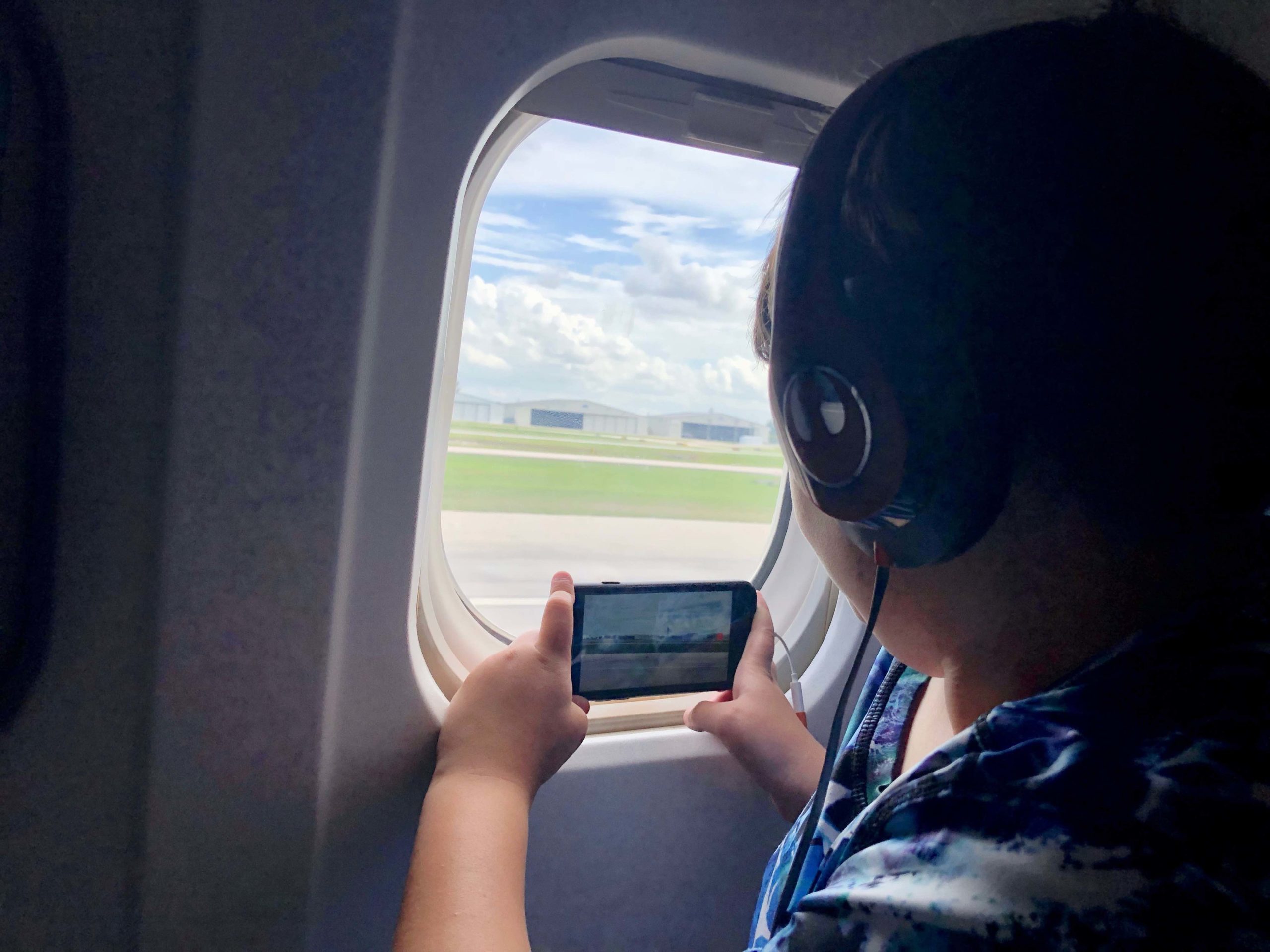 child in a plane seat